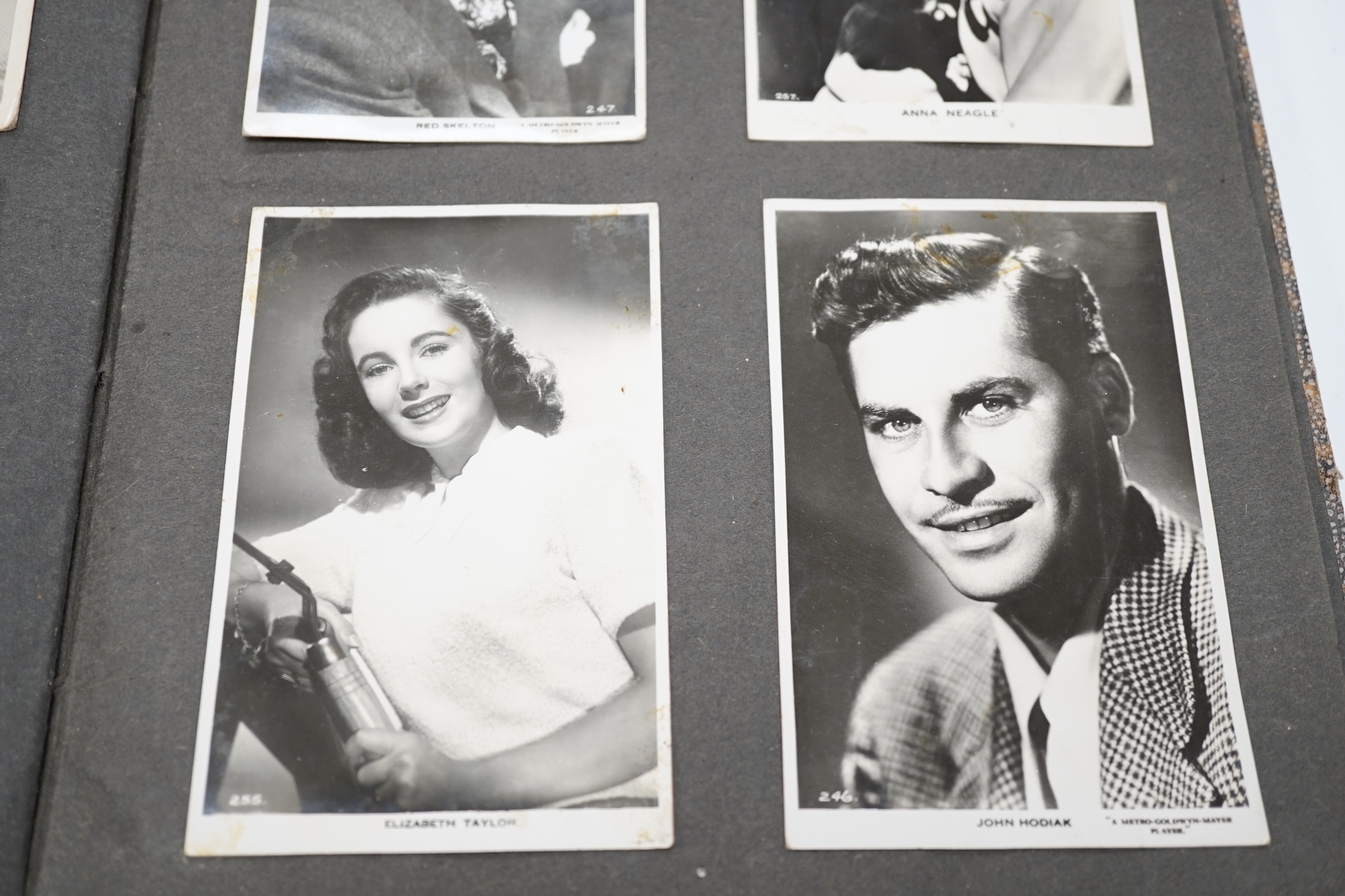 A vintage black and white photograph album with some autographs including Lucille Ball and Margaret O’Brien